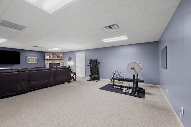 4705 E Hampton Blvd, Morristown, TN 37813 - workout room featuring baseboards, a drop ceiling, carpet floors, and a fireplace