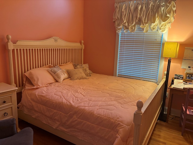 bedroom with wood finished floors