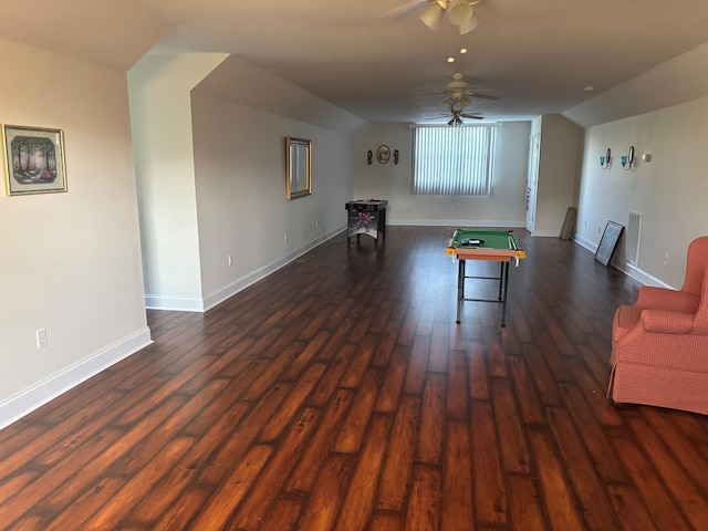 game room with a ceiling fan, dark wood-style flooring, lofted ceiling, and baseboards