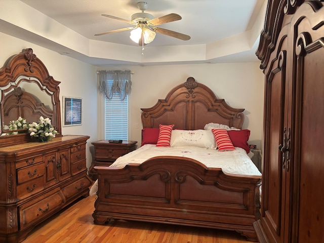 bedroom with light wood-style floors and ceiling fan