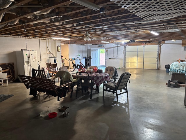 garage with white fridge with ice dispenser
