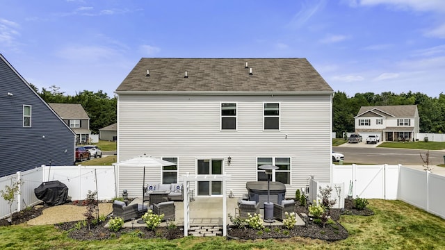 5021 Cottonseed Way, Morristown, TN 37813 - back of property featuring an outdoor living space, a patio area, a fenced backyard, and a hot tub