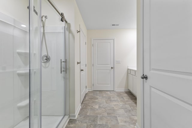 5021 Cottonseed Way, Morristown, TN 37813 - full bathroom with a stall shower, vanity, and stone finish flooring