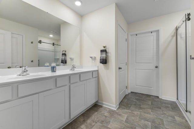 5021 Cottonseed Way, Morristown, TN 37813 - bathroom with a shower stall, double vanity, stone finish flooring, and recessed lighting