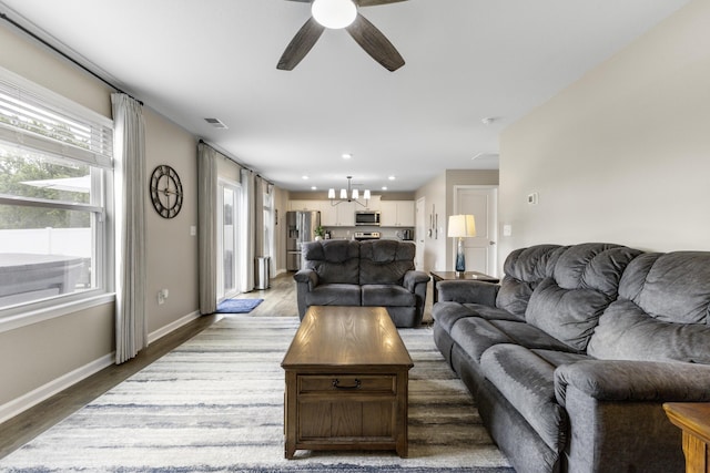 5021 Cottonseed Way, Morristown, TN 37813 - living room featuring a chandelier, a ceiling fan, wood finished floors, and recessed lighting