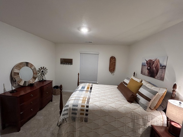bedroom featuring baseboards, carpet flooring, and visible vents