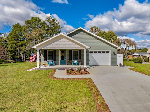 view of front of property with covered porch, a front yard, and a garage