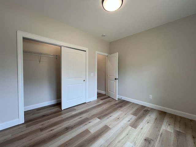 553 Sequoyah Dr, Morristown, TN 37813 - unfurnished bedroom featuring a closet, wood finished floors, and baseboards