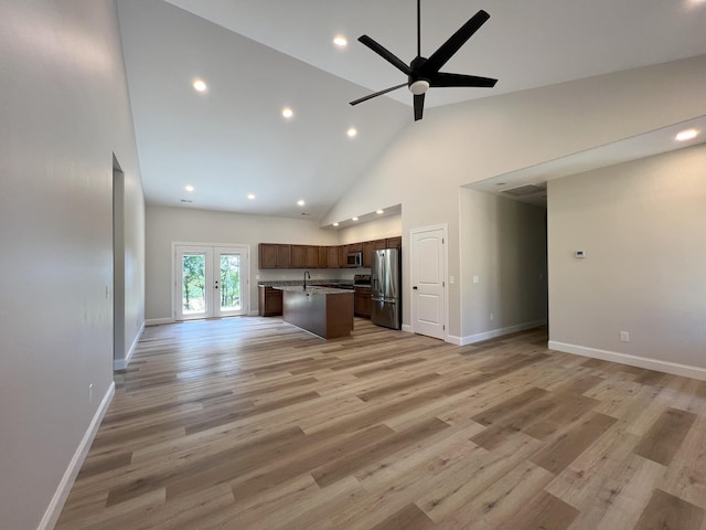 553 Sequoyah Dr, Morristown, TN 37813 - unfurnished living room with ceiling fan, high vaulted ceiling, a sink, baseboards, and french doors