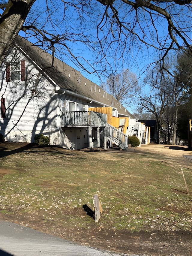 view of side of property with a wooden deck