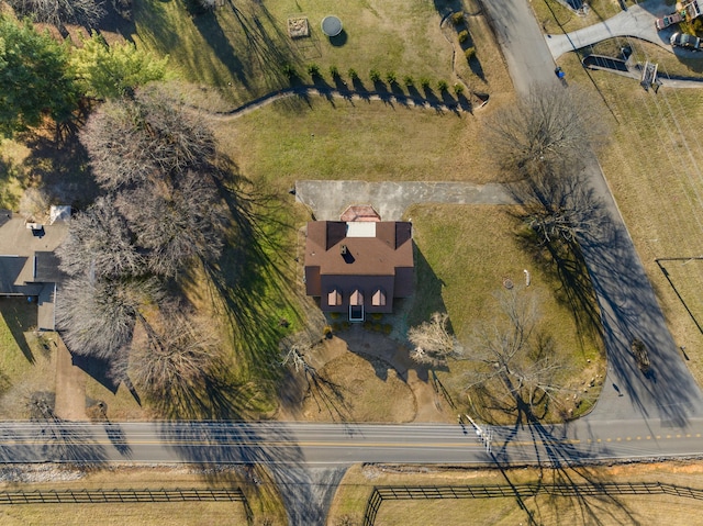 birds eye view of property with a rural view