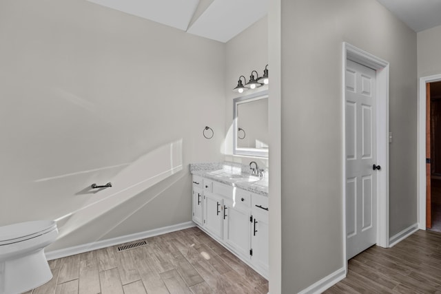 bathroom featuring vanity and hardwood / wood-style floors