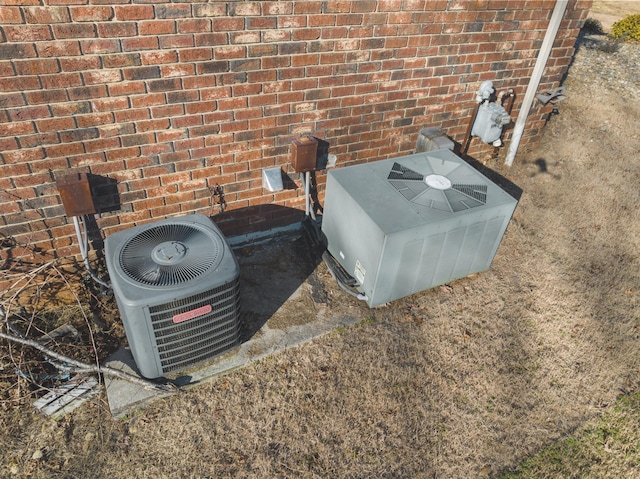 details featuring central AC and a wood stove