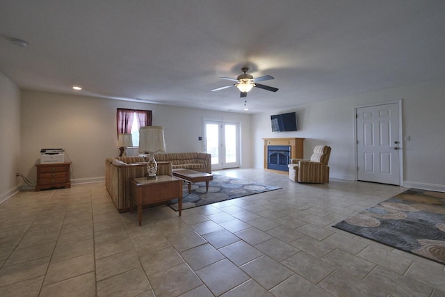 living room featuring ceiling fan and light tile patterned flooring