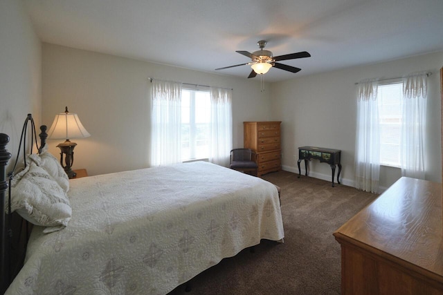 bedroom featuring dark colored carpet and ceiling fan