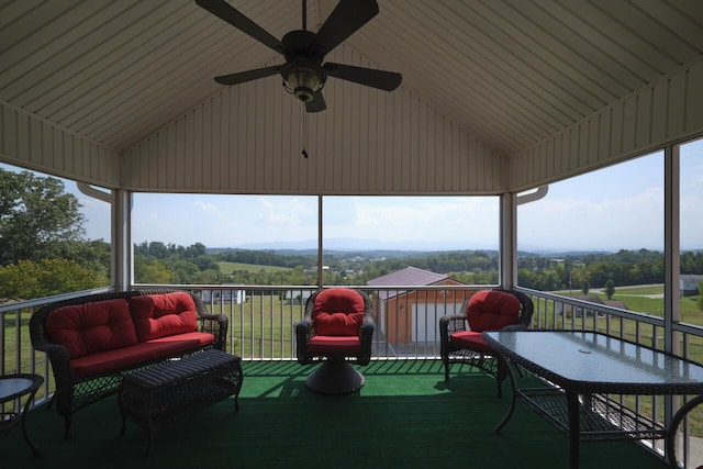 exterior space featuring ceiling fan and a balcony