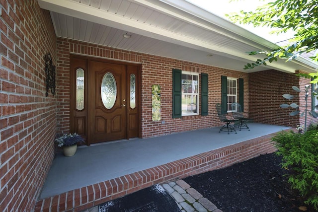 entrance to property featuring a porch