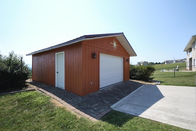 garage featuring a lawn