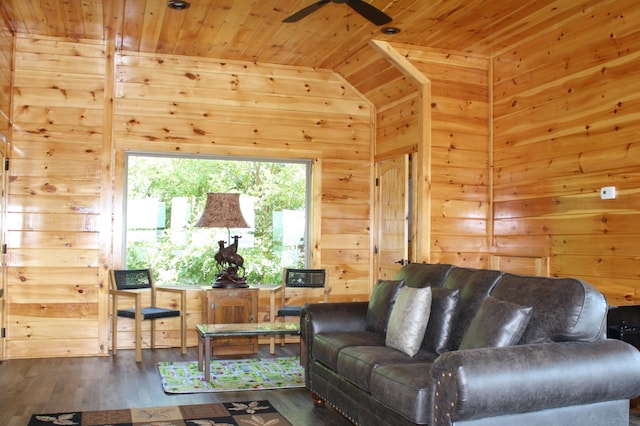 living room with hardwood / wood-style flooring, wood walls, and wooden ceiling