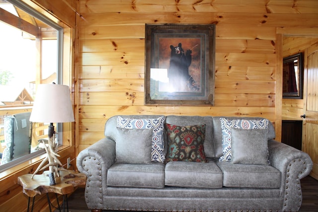 living room with wood walls