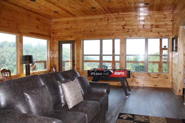 living room with wood walls, dark hardwood / wood-style flooring, and wood ceiling