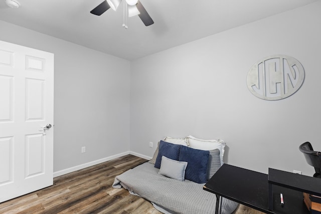 living area with ceiling fan and wood-type flooring