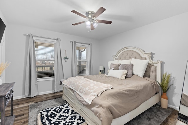 bedroom featuring ceiling fan and dark hardwood / wood-style floors