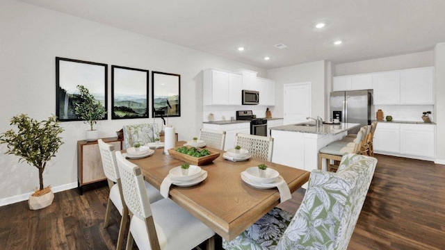 dining room featuring dark wood-style floors, recessed lighting, and baseboards