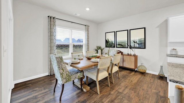 dining area with dark wood finished floors, baseboards, and recessed lighting