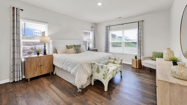 bedroom with dark wood-style floors, baseboards, and recessed lighting
