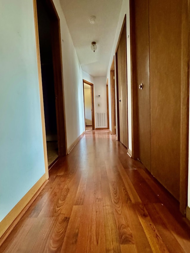 hallway featuring light wood-type flooring