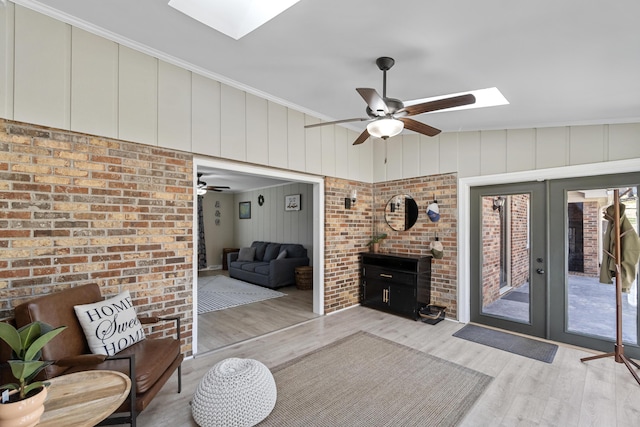 45 Link Hills Cir, Greeneville, TN 37743 - living room featuring a skylight, wood finished floors, a ceiling fan, and french doors
