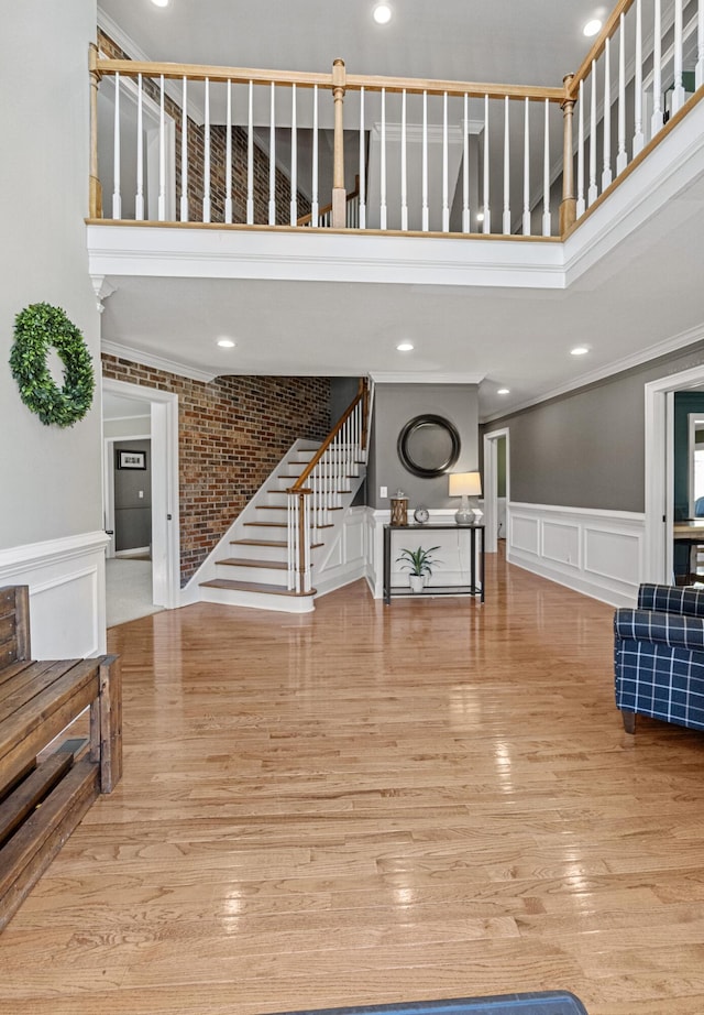 45 Link Hills Cir, Greeneville, TN 37743 - entrance foyer featuring stairs, a towering ceiling, ornamental molding, a decorative wall, and wood finished floors