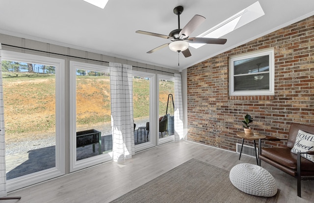 45 Link Hills Cir, Greeneville, TN 37743 - sunroom with a skylight, ornamental molding, brick wall, wood finished floors, and plenty of natural light