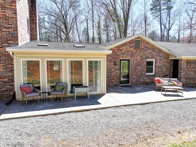 45 Link Hills Cir, Greeneville, TN 37743 - back of property with an outdoor living space, a patio, brick siding, and a shingled roof