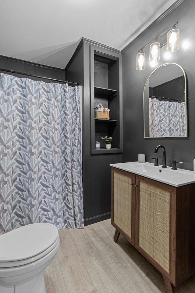 45 Link Hills Cir, Greeneville, TN 37743 - full bath featuring built in shelves, vanity, wood finished floors, and toilet