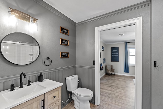 45 Link Hills Cir, Greeneville, TN 37743 - bathroom featuring crown molding, wood finished floors, toilet, vanity, and wainscoting
