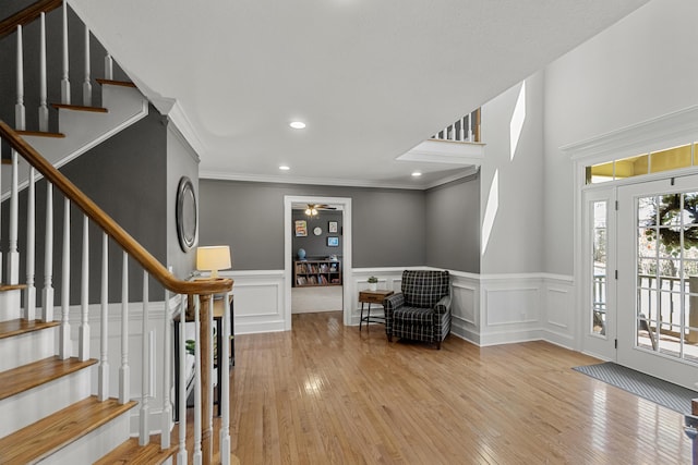 45 Link Hills Cir, Greeneville, TN 37743 - foyer entrance featuring hardwood / wood-style flooring, stairs, a wainscoted wall, a ceiling fan, and crown molding