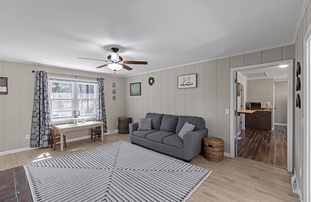 45 Link Hills Cir, Greeneville, TN 37743 - living room featuring wood finished floors, a ceiling fan, attic access, crown molding, and a decorative wall