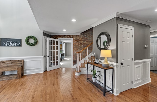 45 Link Hills Cir, Greeneville, TN 37743 - entrance foyer featuring crown molding, stairs, wood-type flooring, french doors, and brick wall