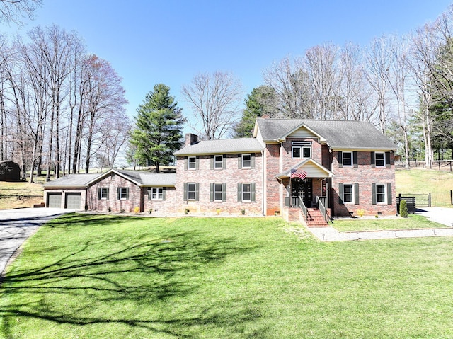 45 Link Hills Cir, Greeneville, TN 37743 - view of front facade with driveway, brick siding, a garage, and a chimney