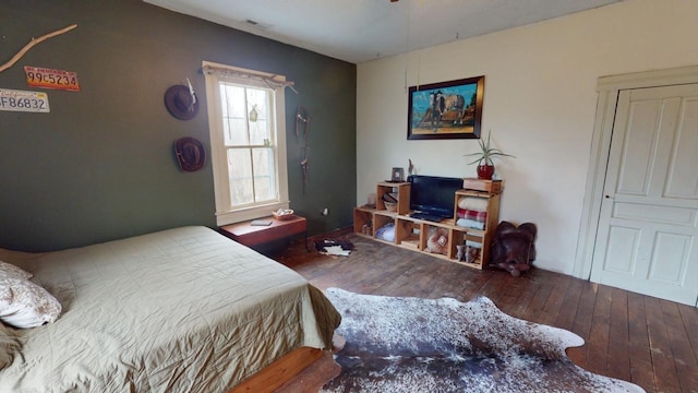 bedroom with hardwood / wood-style flooring