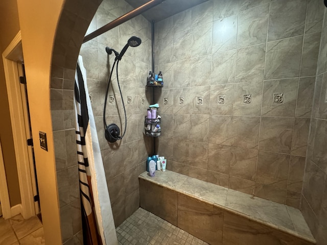 bathroom with a tile shower