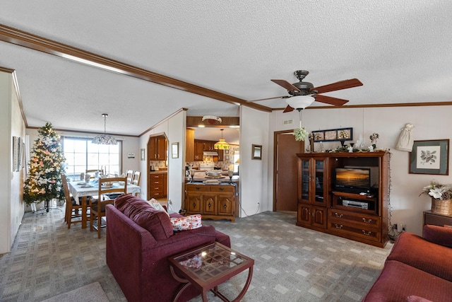 1554 Old Parrotsville Hwy, Parrottsville, TN 37843 - living area with ornamental molding, a ceiling fan, a textured ceiling, a chandelier, and carpet flooring