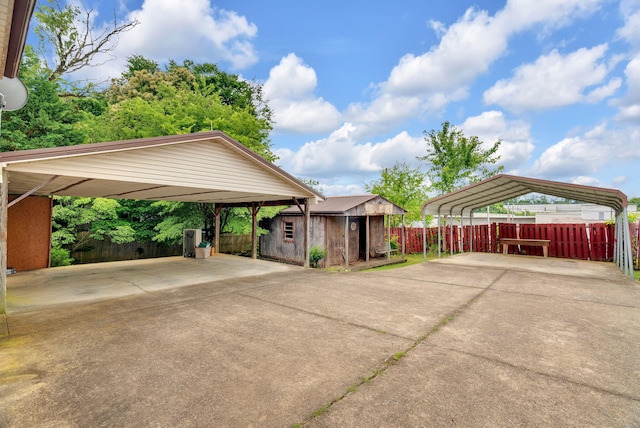 view of vehicle parking with a carport