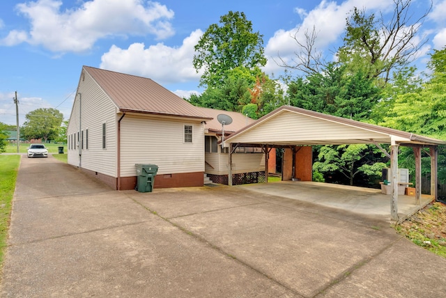 view of side of property featuring a carport