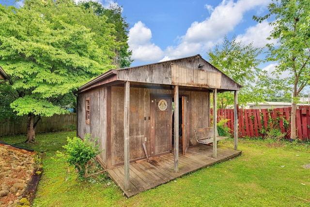 view of outdoor structure featuring a lawn