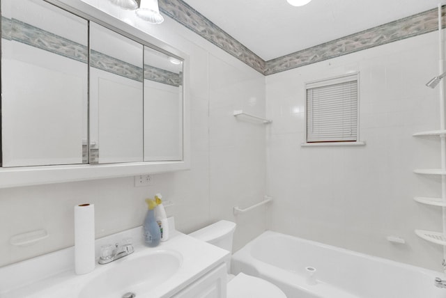 full bathroom featuring vanity, toilet, and washtub / shower combination