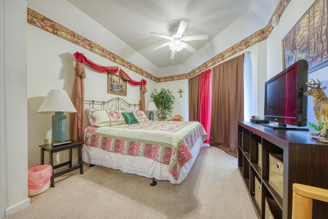 bedroom featuring carpet floors, a textured ceiling, baseboards, and a ceiling fan