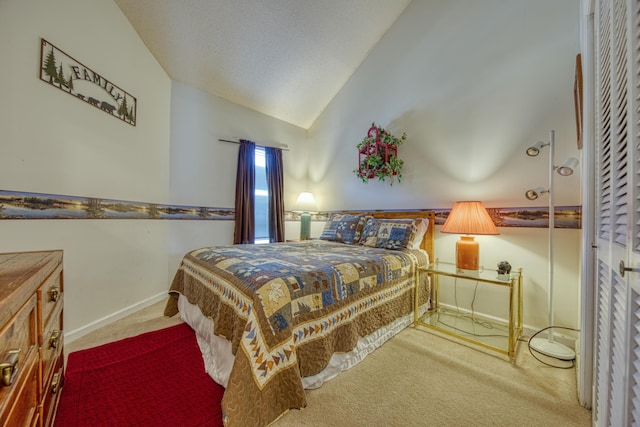 carpeted bedroom featuring lofted ceiling and baseboards